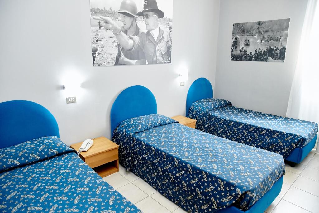 Postel nebo postele na pokoji v ubytování Hotel Ospite Inatteso