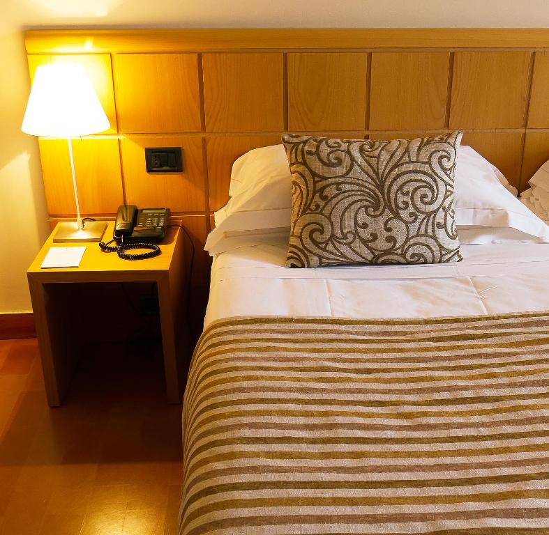 Postel nebo postele na pokoji v ubytování Hotel dei Duchi