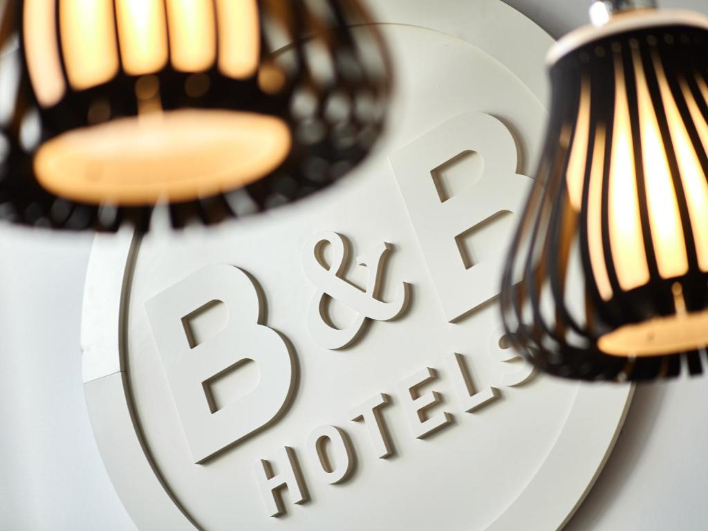 two lights on a plate with a bbq sign at B&B HOTEL Honfleur in Honfleur