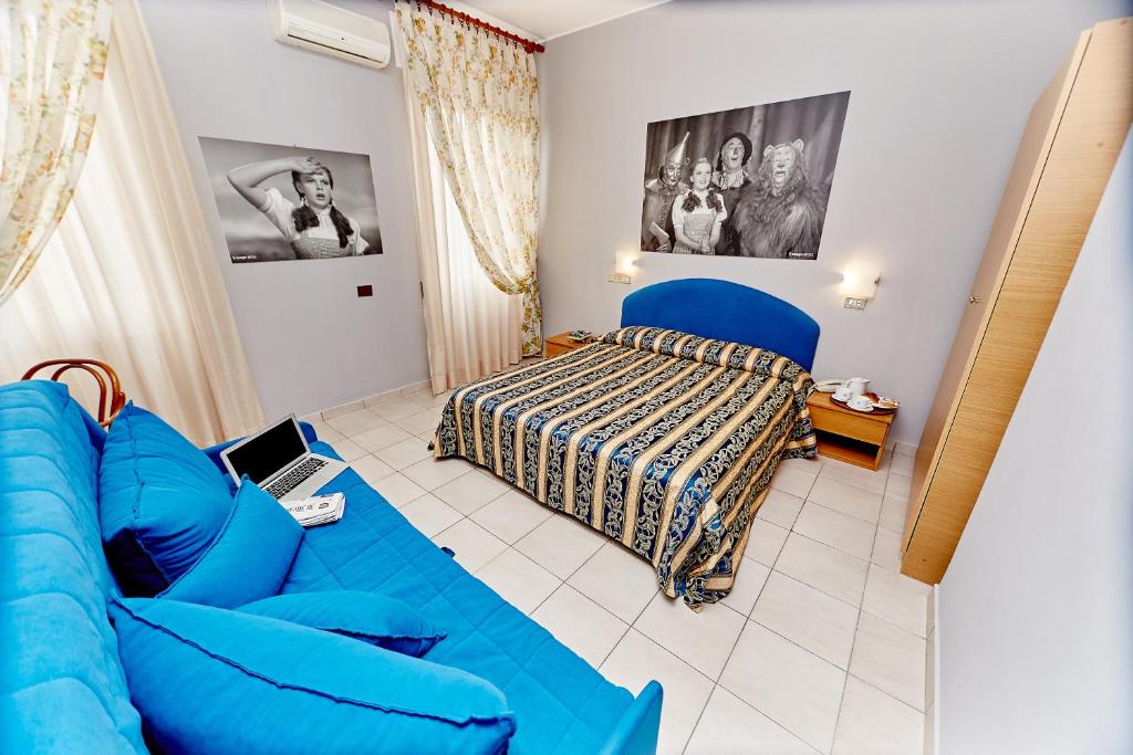 Postel nebo postele na pokoji v ubytování Hotel Ospite Inatteso