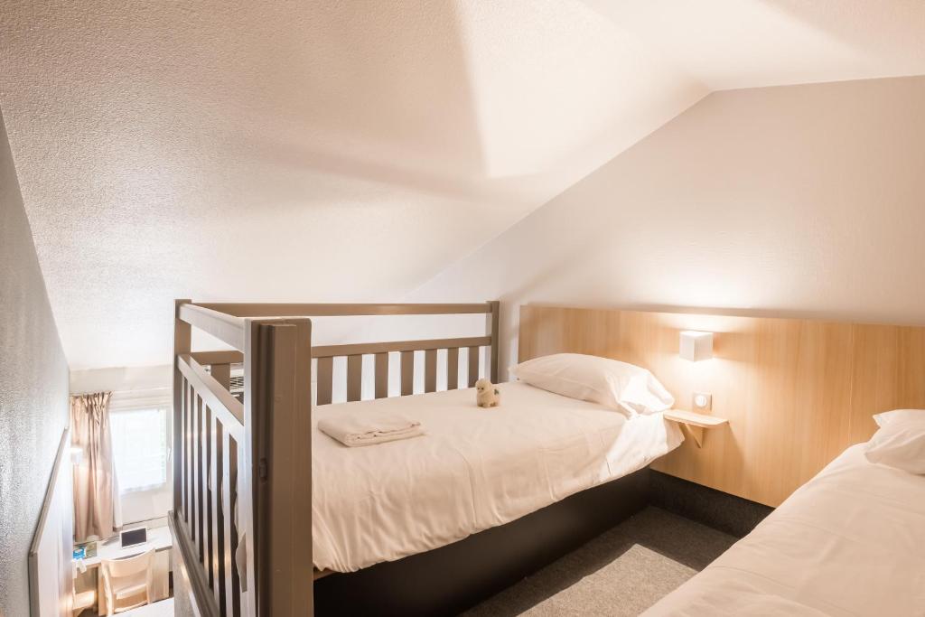 Postel nebo postele na pokoji v ubytování B&B HOTEL Valence Nord