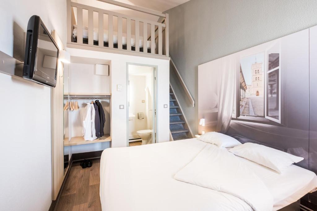 Postel nebo postele na pokoji v ubytování B&B HOTEL Valence Nord