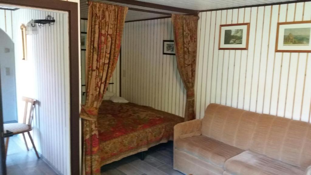 Postel nebo postele na pokoji v ubytování Elbenland Apartments & Bungalows
