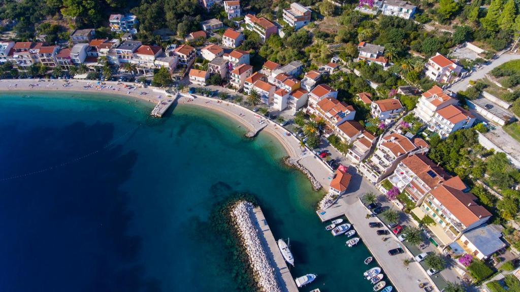 an aerial view of a beach with boats in the water at Apartments Lara in Podgora