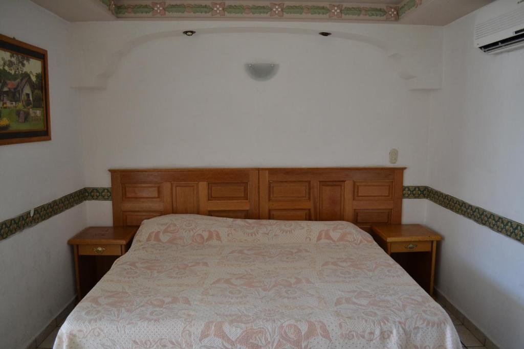 Postel nebo postele na pokoji v ubytování Hotel Senorial