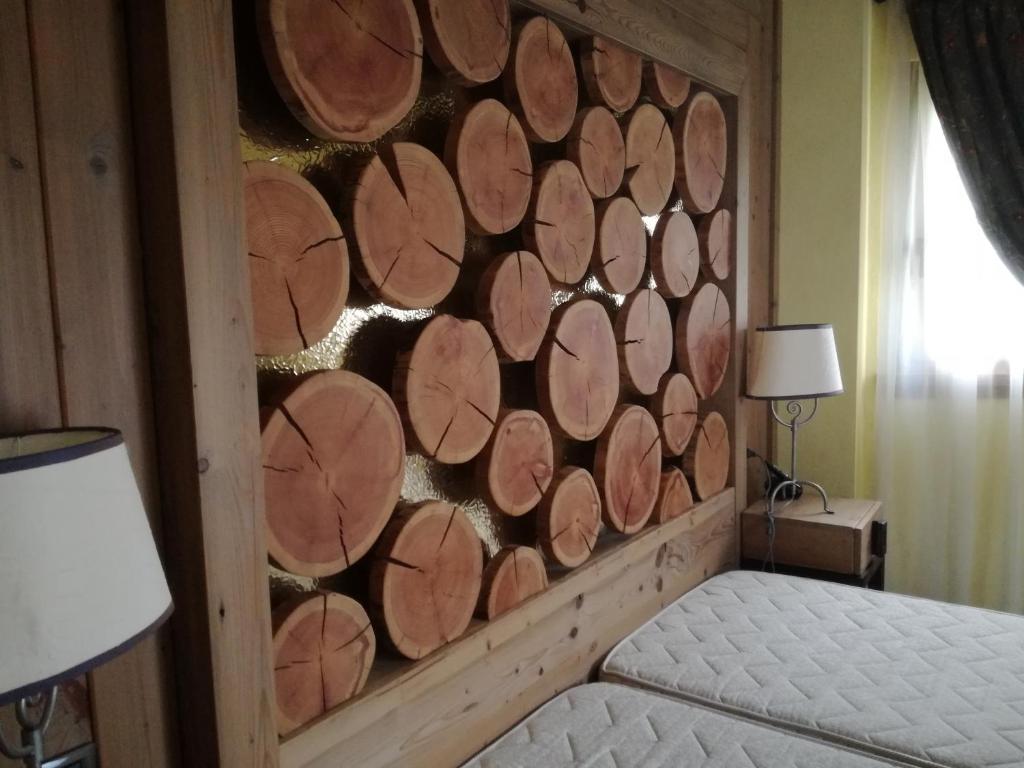 Postel nebo postele na pokoji v ubytování Hotel Bait de Angial