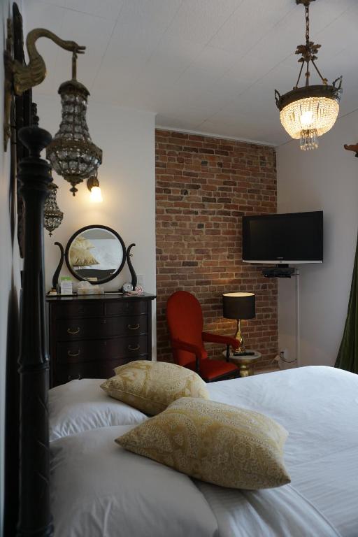 Postel nebo postele na pokoji v ubytování Hôtel Marie-Rollet