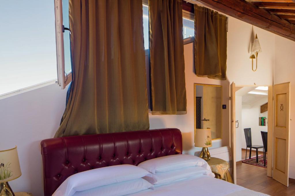 Postel nebo postele na pokoji v ubytování Palazzo Rotati