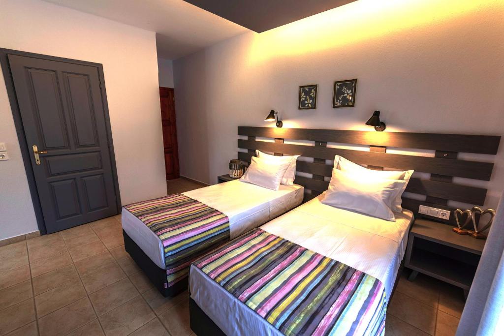 Posteľ alebo postele v izbe v ubytovaní Aliston Hotel Thassos