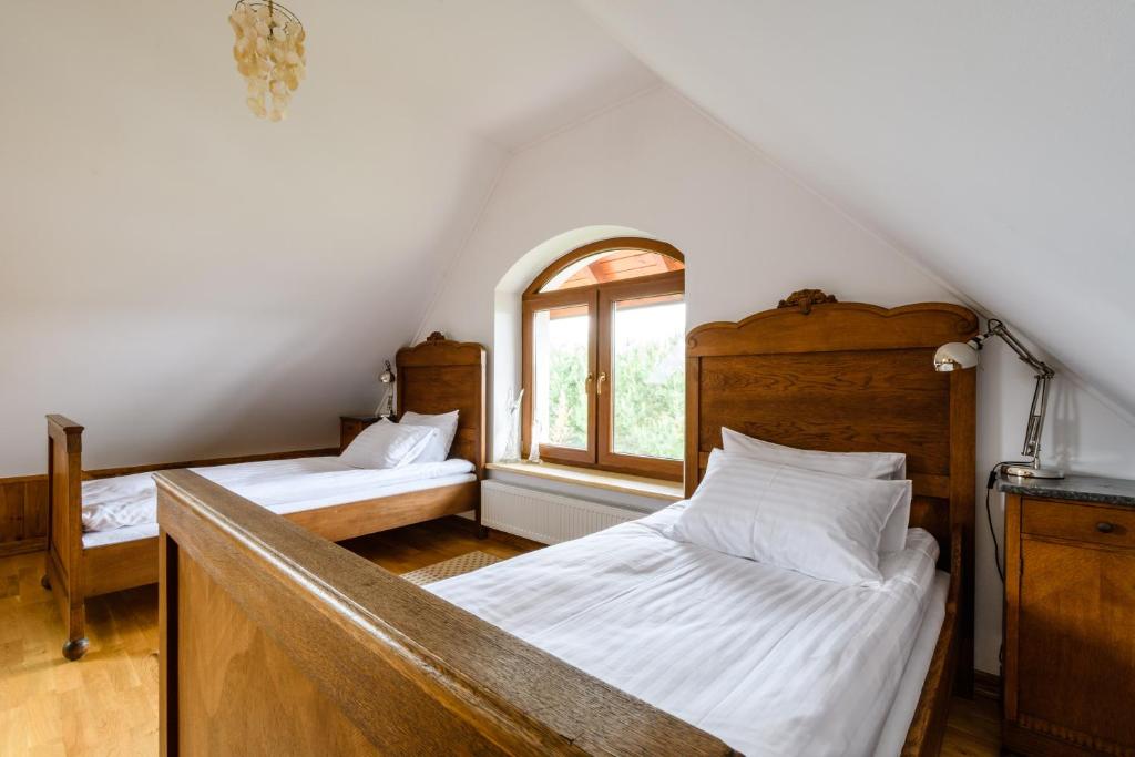 Postel nebo postele na pokoji v ubytování Rezydencja Rodzinna