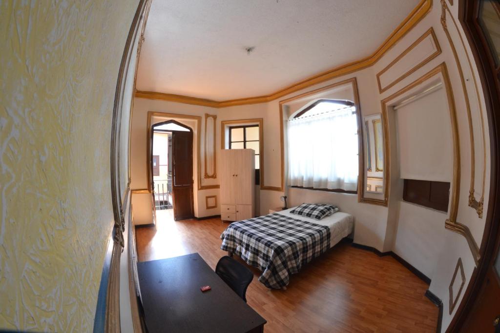 Postel nebo postele na pokoji v ubytování Casa del Sol