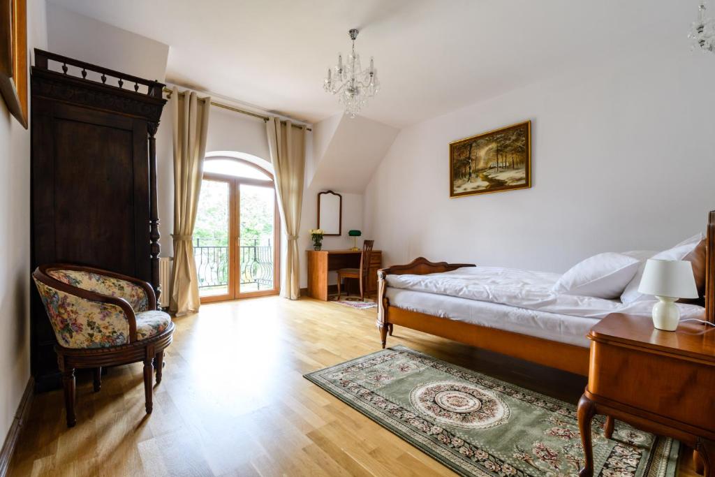 Postel nebo postele na pokoji v ubytování Rezydencja Rodzinna