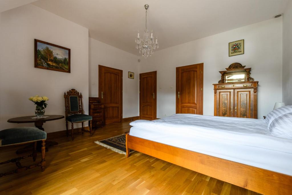 Postel nebo postele na pokoji v ubytování Rezydencja Rodzinna