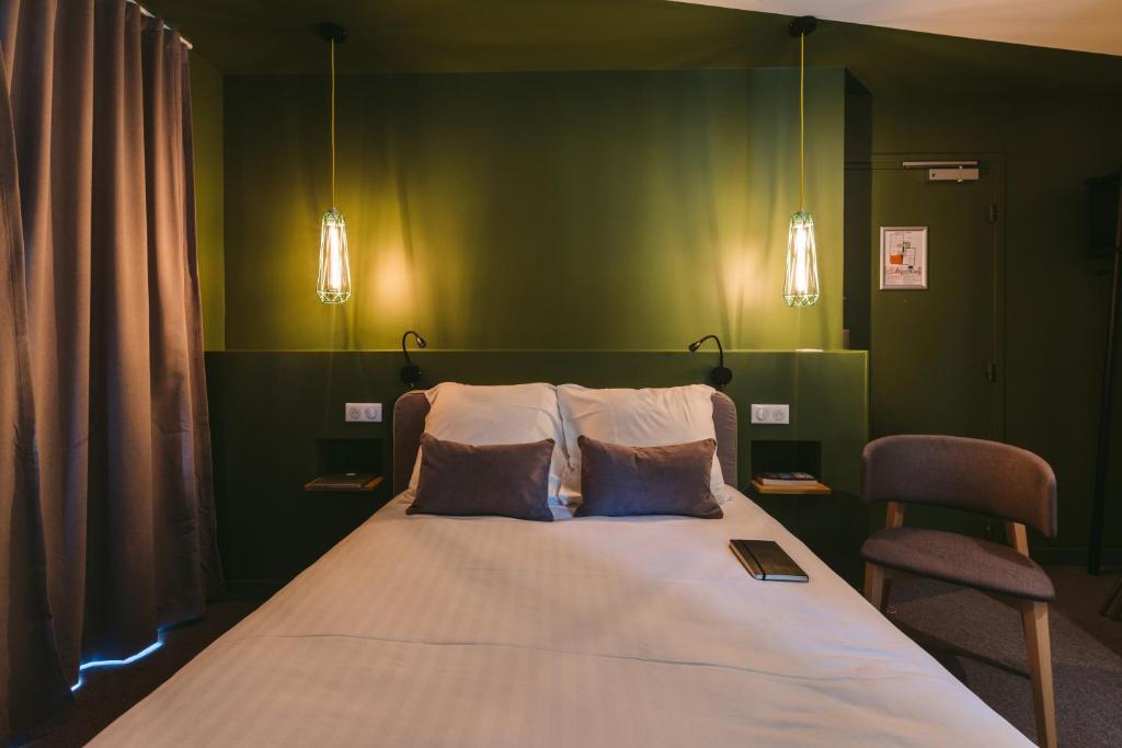 Postel nebo postele na pokoji v ubytování Le Petit Cosy Hôtel