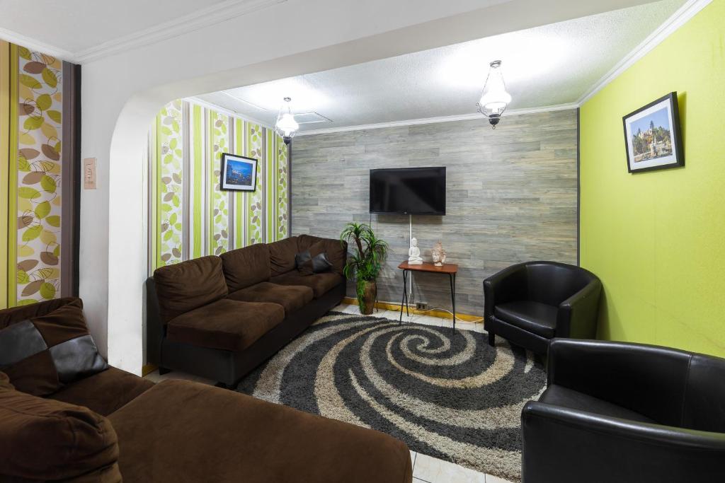 TV a/nebo společenská místnost v ubytování Hostal Caleta Abarca