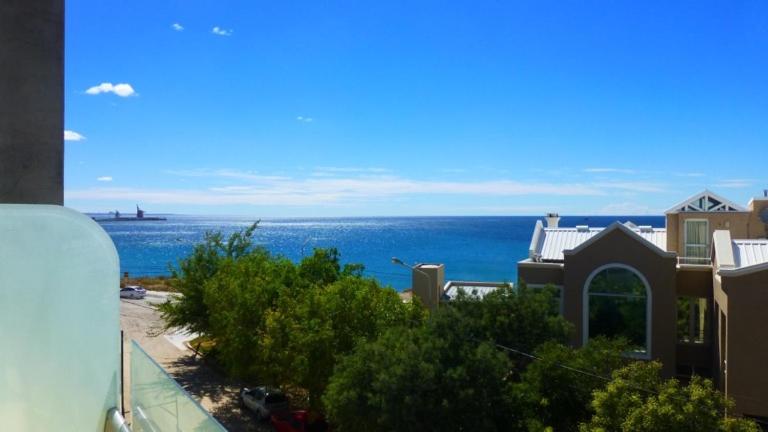 a view of the ocean from a house at Ayres del Sur in Puerto Madryn