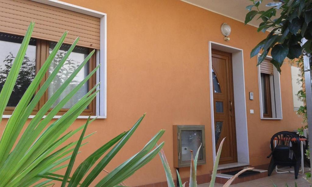 a house with a plant in front of it at Come a casa - near VENEZIA in Oriago Di Mira
