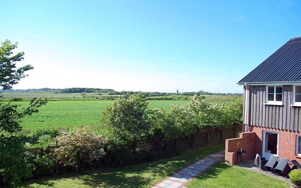 a house with a view of a green field at Leefke in Goting