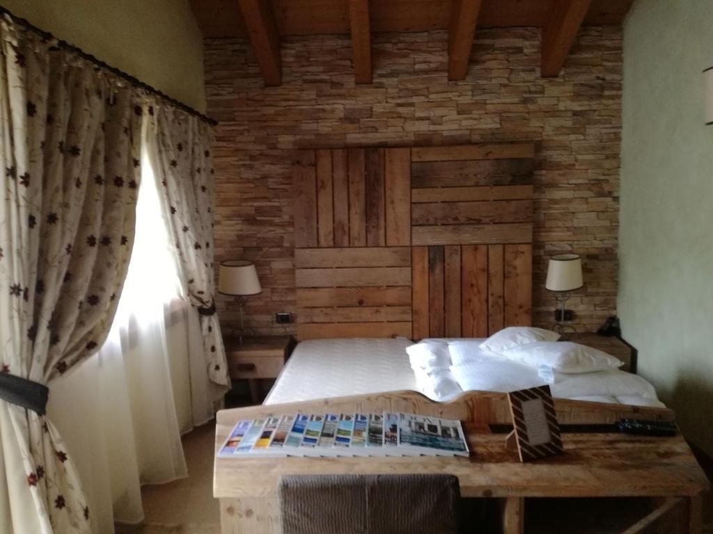 Postel nebo postele na pokoji v ubytování Hotel Bait de Angial