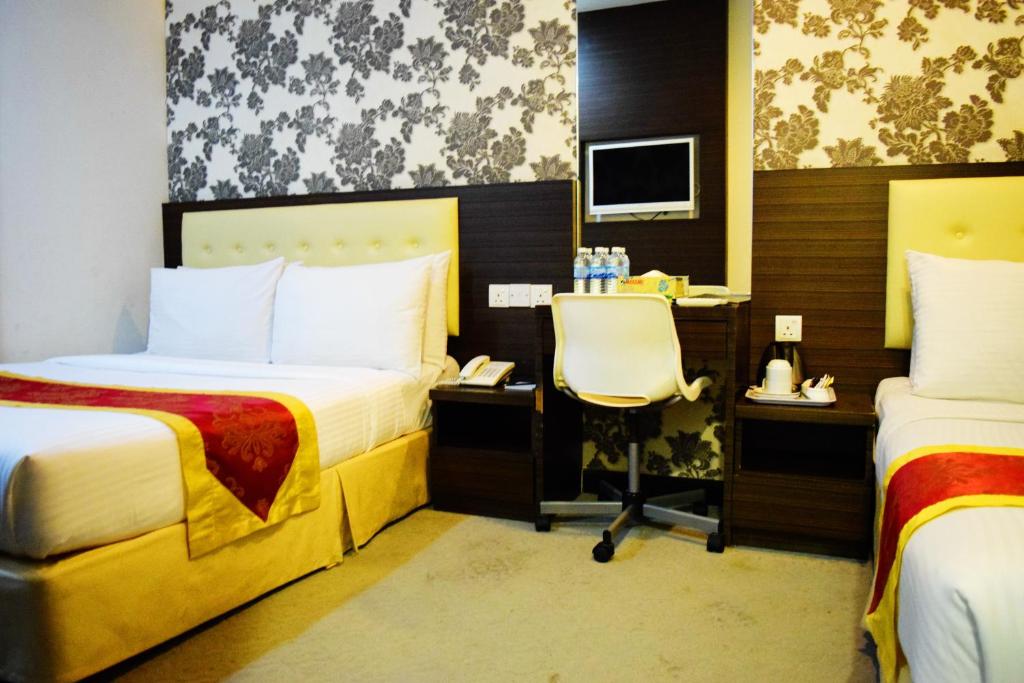 Tempat tidur dalam kamar di Springz Hotel-Bukit Jalil