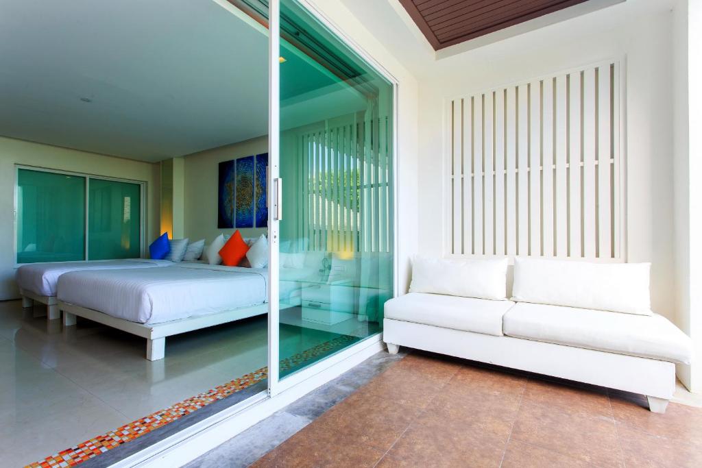 Postel nebo postele na pokoji v ubytování Samui Resotel Beach Resort