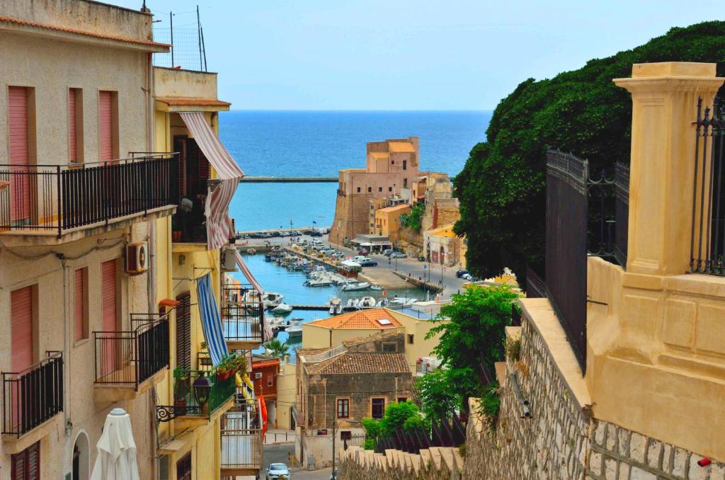 a view of a town with a harbor and the ocean at B&B Nencioli in Castellammare del Golfo
