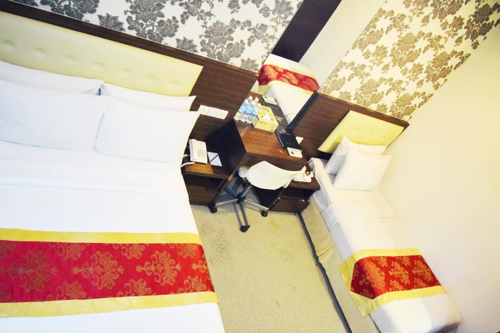 Postel nebo postele na pokoji v ubytování Springz Hotel-Bukit Jalil