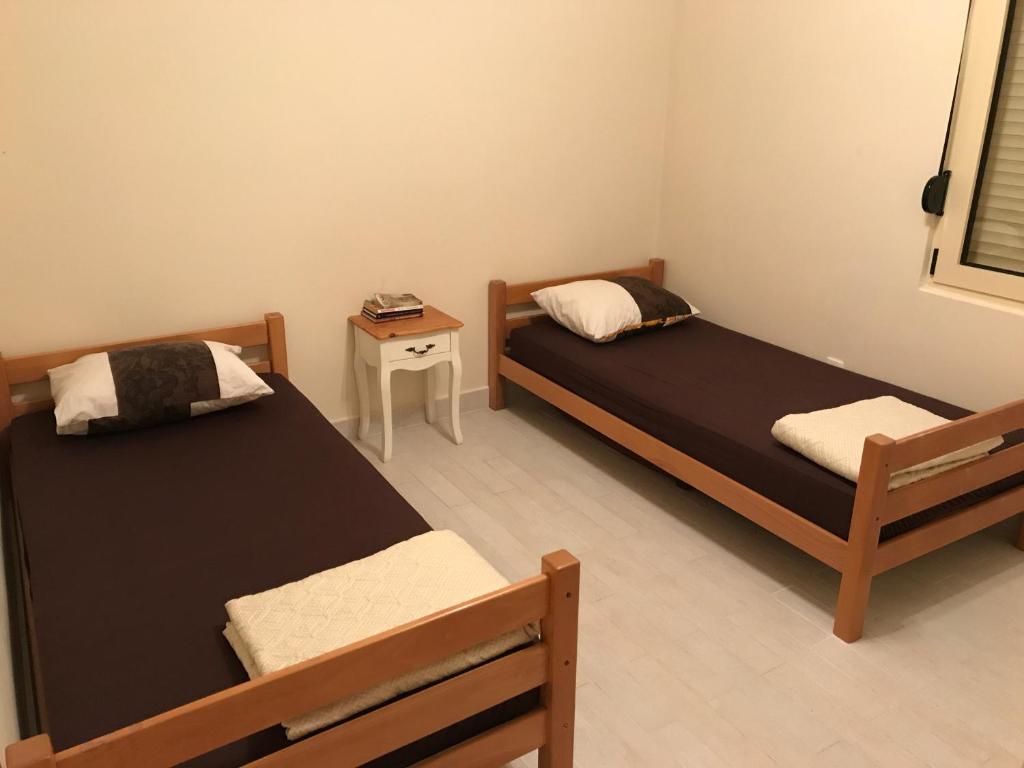 En eller flere senge i et værelse på Holiday Home Sunrise