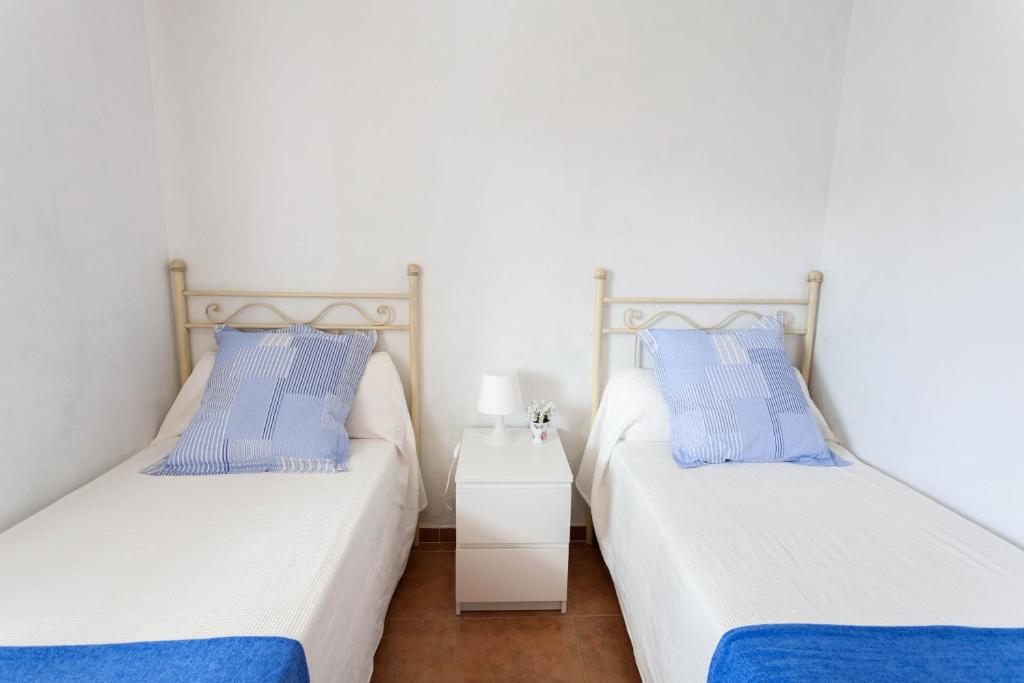 Postel nebo postele na pokoji v ubytování Zahara Tropikala