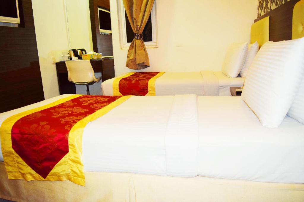Postel nebo postele na pokoji v ubytování Springz Hotel-Bukit Jalil