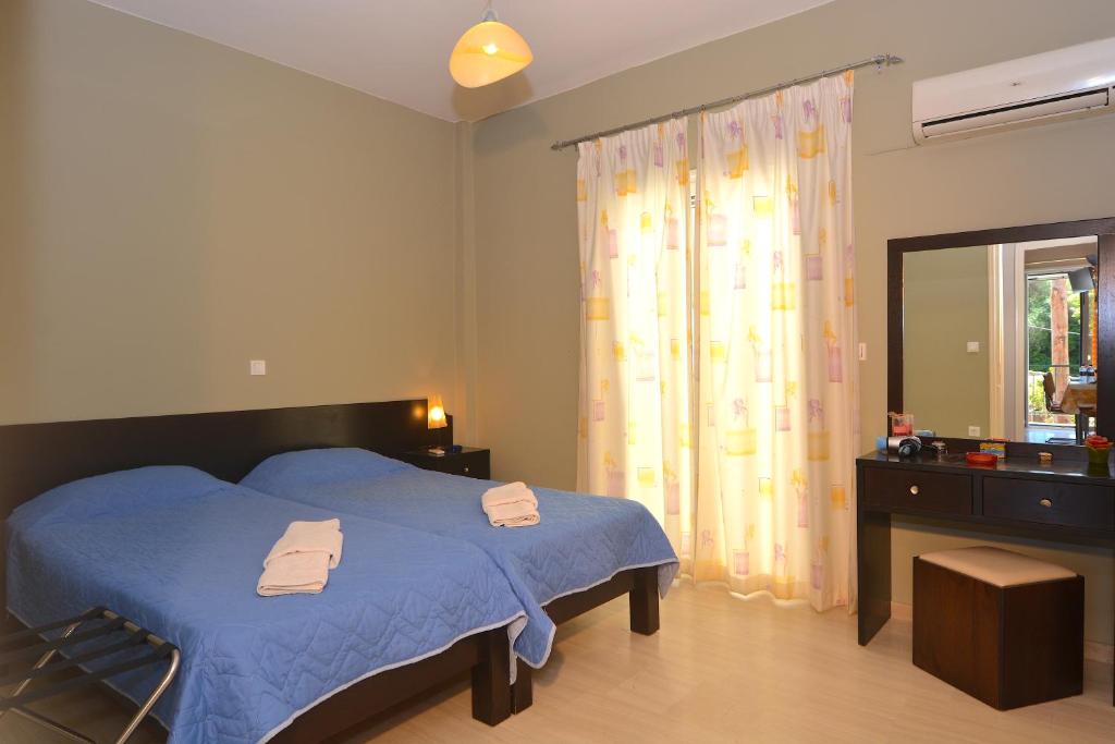 Postel nebo postele na pokoji v ubytování Alexandra Apartment