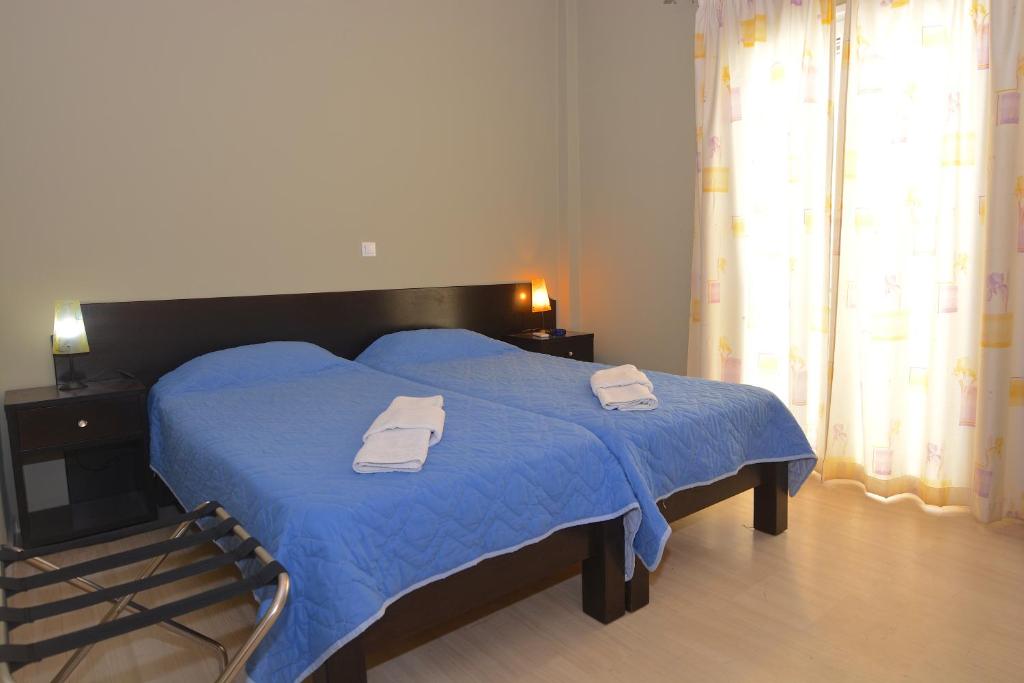 Postel nebo postele na pokoji v ubytování Alexandra Apartment