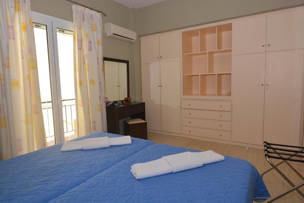 Postel nebo postele na pokoji v ubytování Alexandra Apartment
