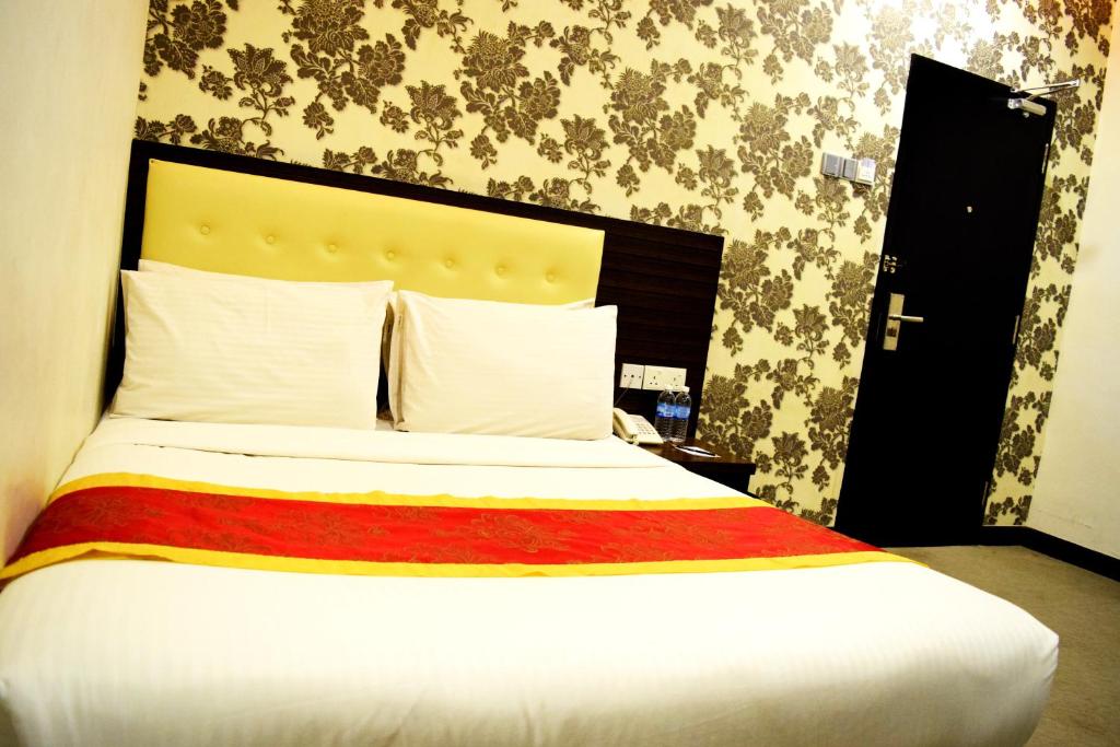 Postel nebo postele na pokoji v ubytování Springz Hotel-Bukit Jalil