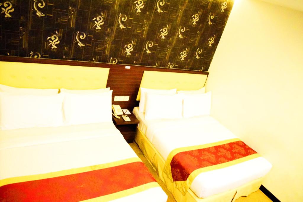 Postel nebo postele na pokoji v ubytování Springz Hotel-Bukit Jalil