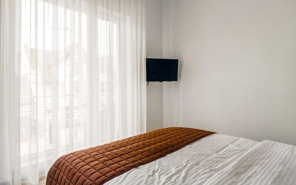 TV a/nebo společenská místnost v ubytování Hotel Sorrento