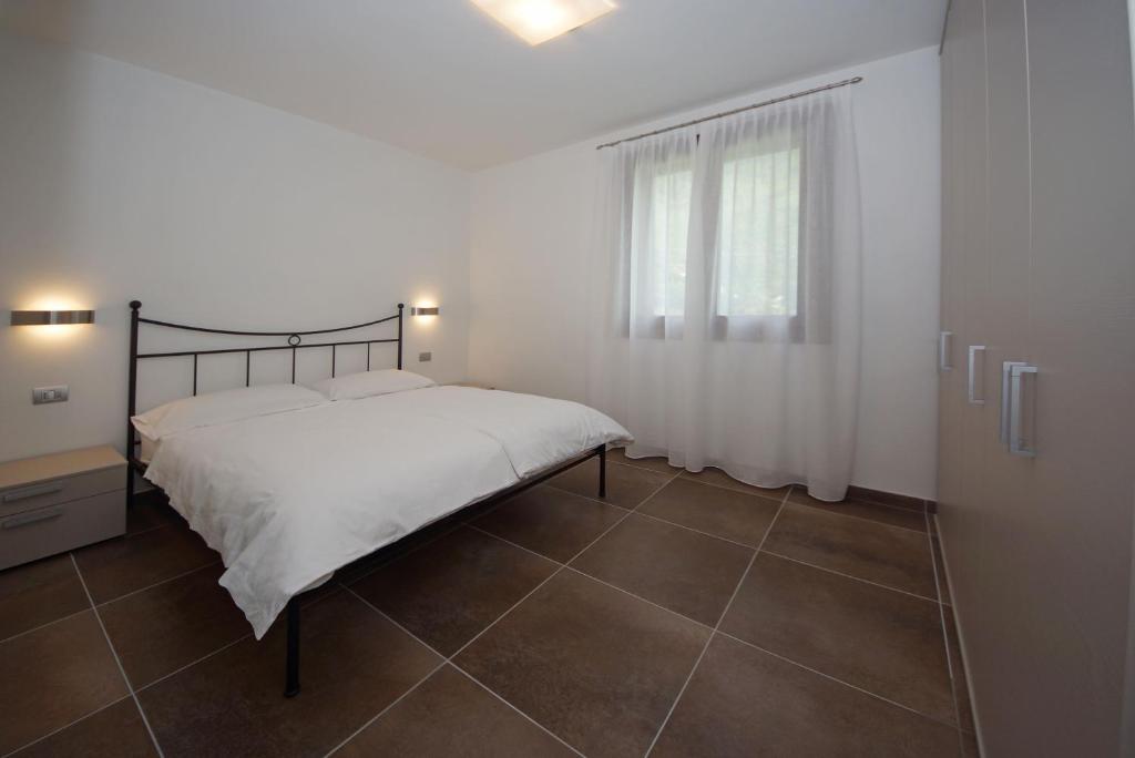 Postel nebo postele na pokoji v ubytování Les Maisons - Ruculì Hospitality