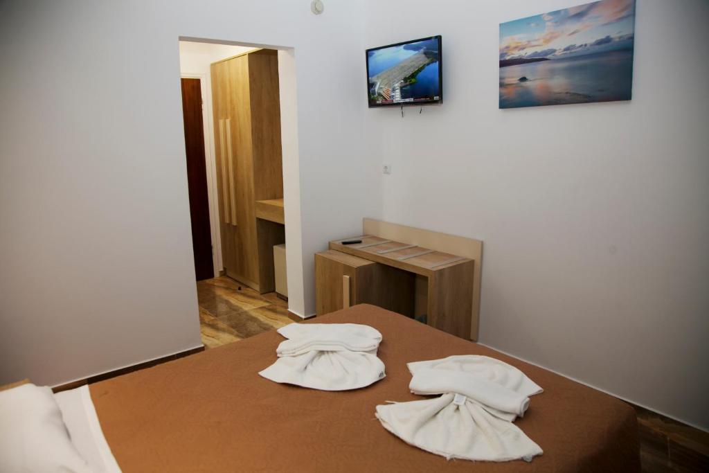 Postel nebo postele na pokoji v ubytování Zeus Hotel