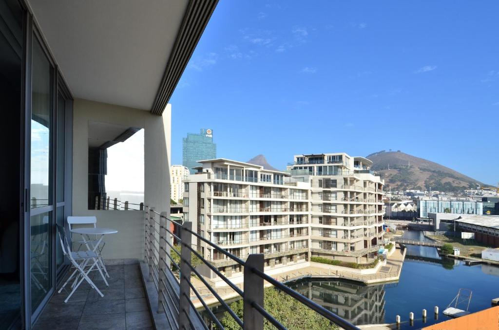 a balcony with a view of some buildings at 410 Harbour Bridge in Cape Town