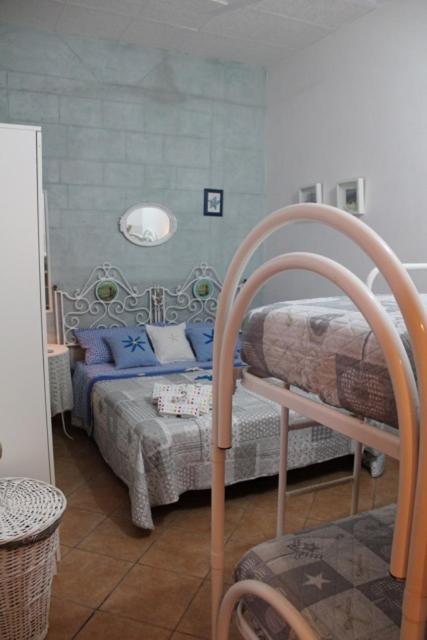 Posteľ alebo postele v izbe v ubytovaní Casa sul Mare vicino Marzamemi