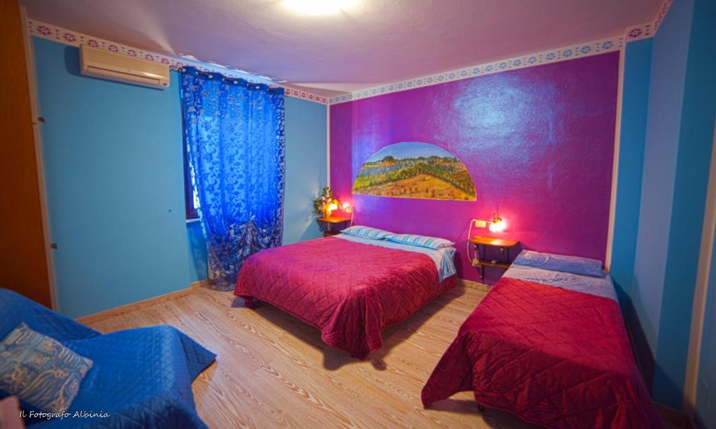 Łóżko lub łóżka w pokoju w obiekcie Agriturismo La Valle degli Ulivi