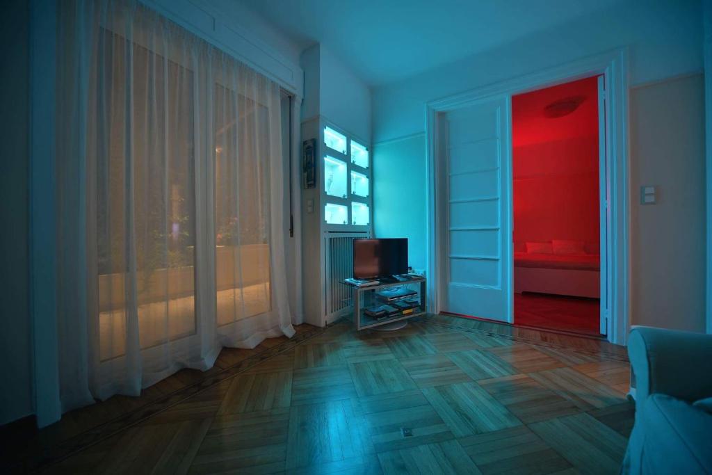 A television and/or entertainment centre at Oasis veranda under columns.Kolonaki embassy area.
