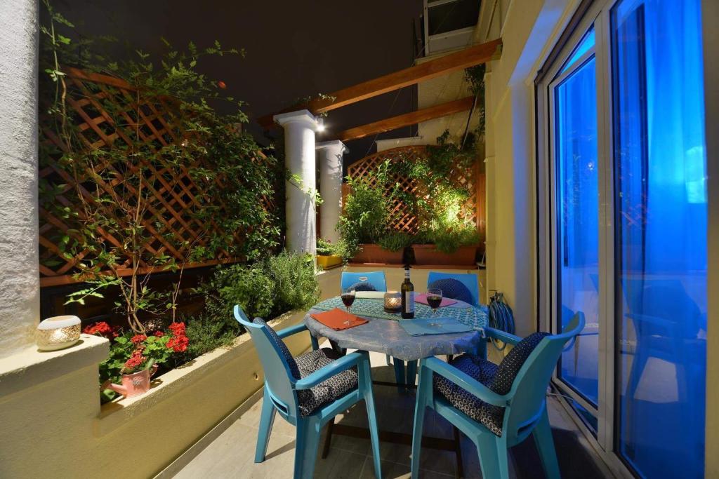 A balcony or terrace at Oasis veranda under columns.Kolonaki embassy area.