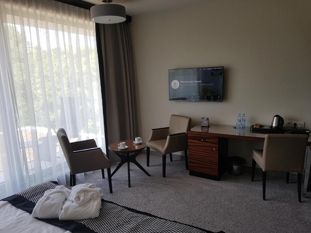 Televízia a/alebo spoločenská miestnosť v ubytovaní Apartament prywatny 329 w Diune Resort