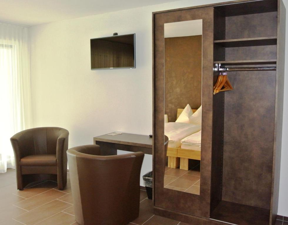 Postel nebo postele na pokoji v ubytování Hotel Restaurant Jura