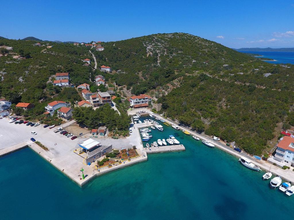 an aerial view of a harbor with boats in the water at Apartment and rooms Roko in Zaglav