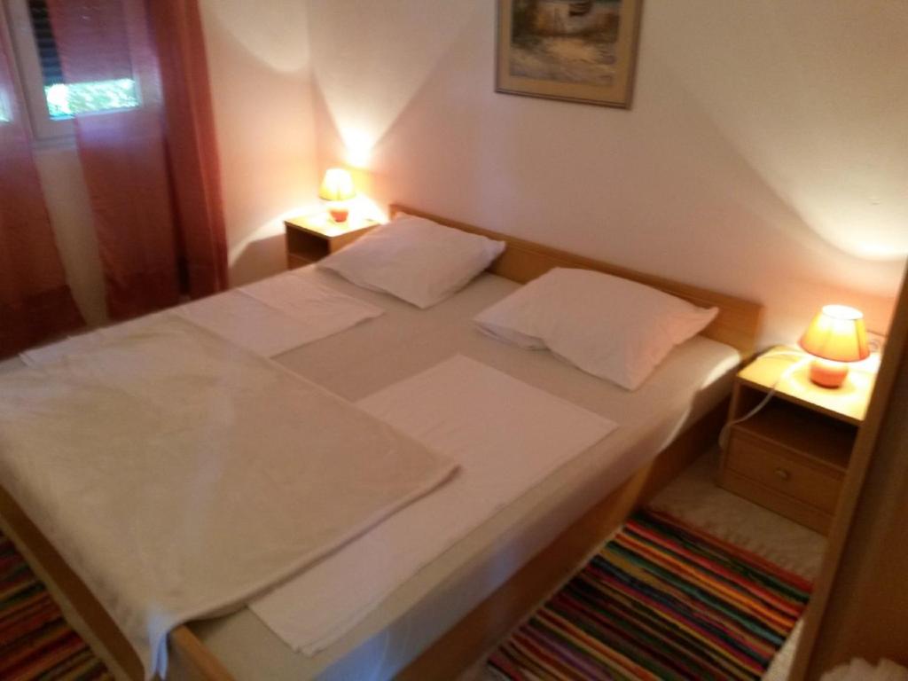 Postel nebo postele na pokoji v ubytování Apartments Verica