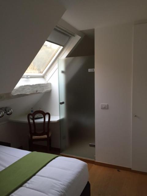 Postel nebo postele na pokoji v ubytování Hotel Le Clos des Récollets