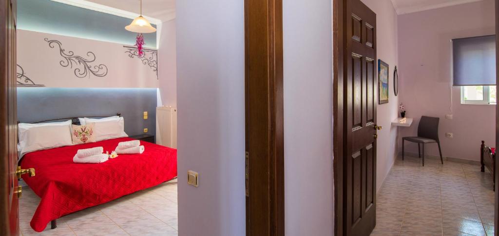 A bed or beds in a room at Ostria Apartments