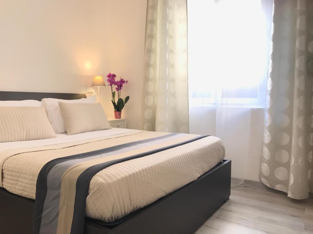 Krevet ili kreveti u jedinici u objektu Angolo di Roma Guest house